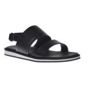 Sandal in black perforated calfskin