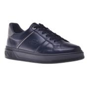 Trainers in black leather and tumbled leather