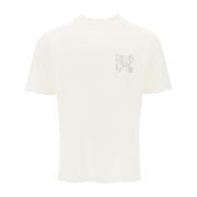 T-shirt med nitter og monogram